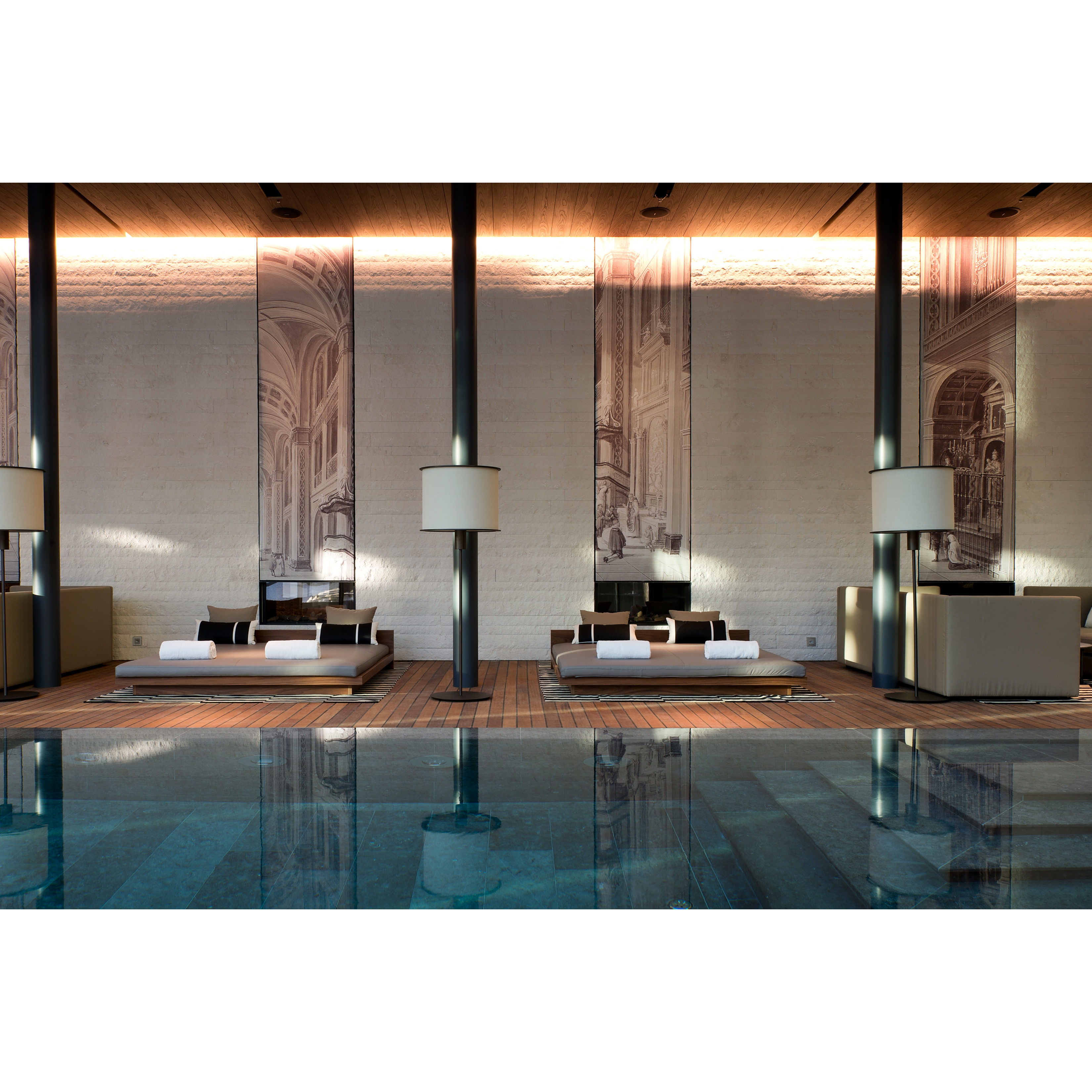 The Chedi Andermatt - Swiss Alps Luxury Hotel - indoor pool and lounge chairs of luxury spa hotel
