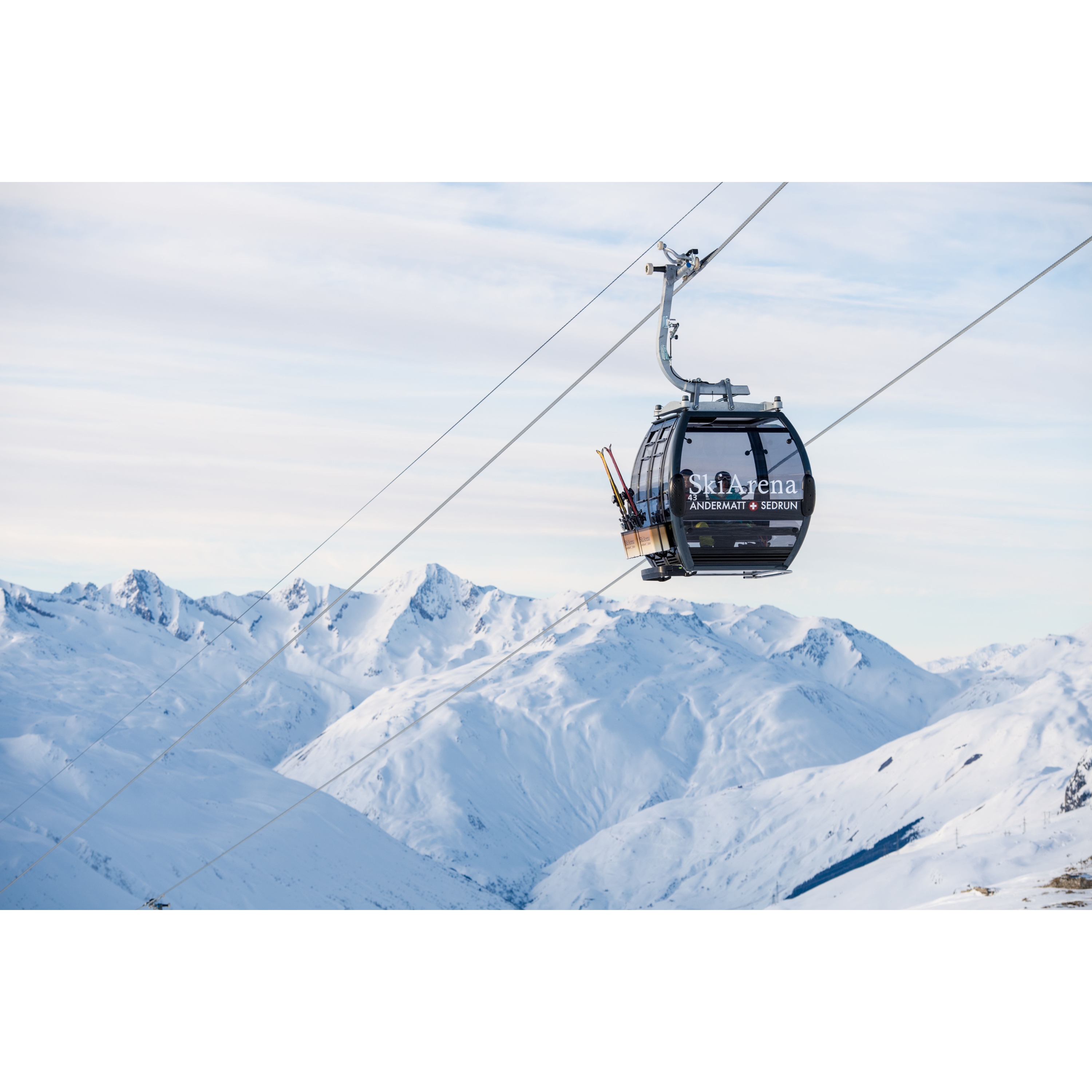 Gondola during the ascent in the Swiss Alps in winter.