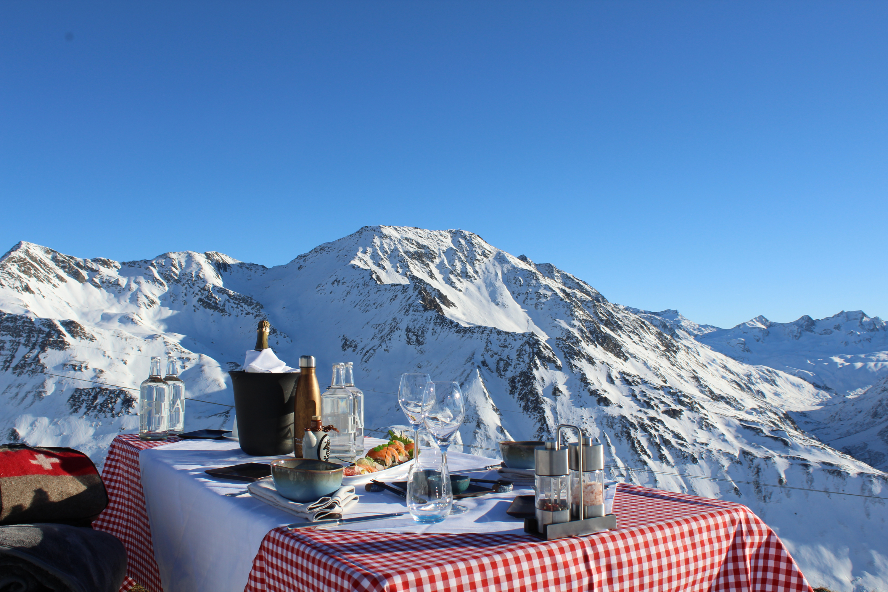 A Gourmet outdoor food setup with stunning mountain view